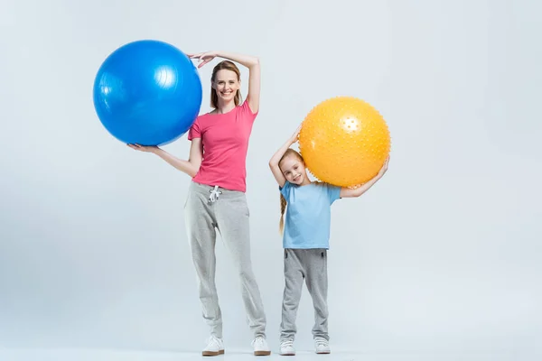 Mother and daughter with fitness balls — Stock Photo, Image