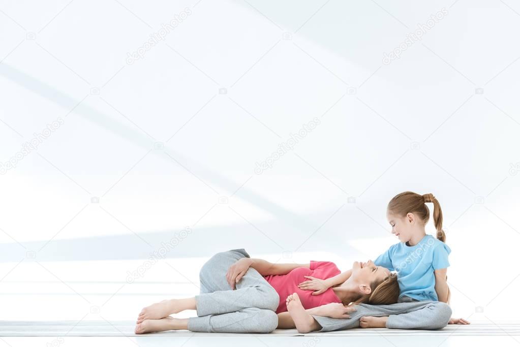 Mother and daughter exercising