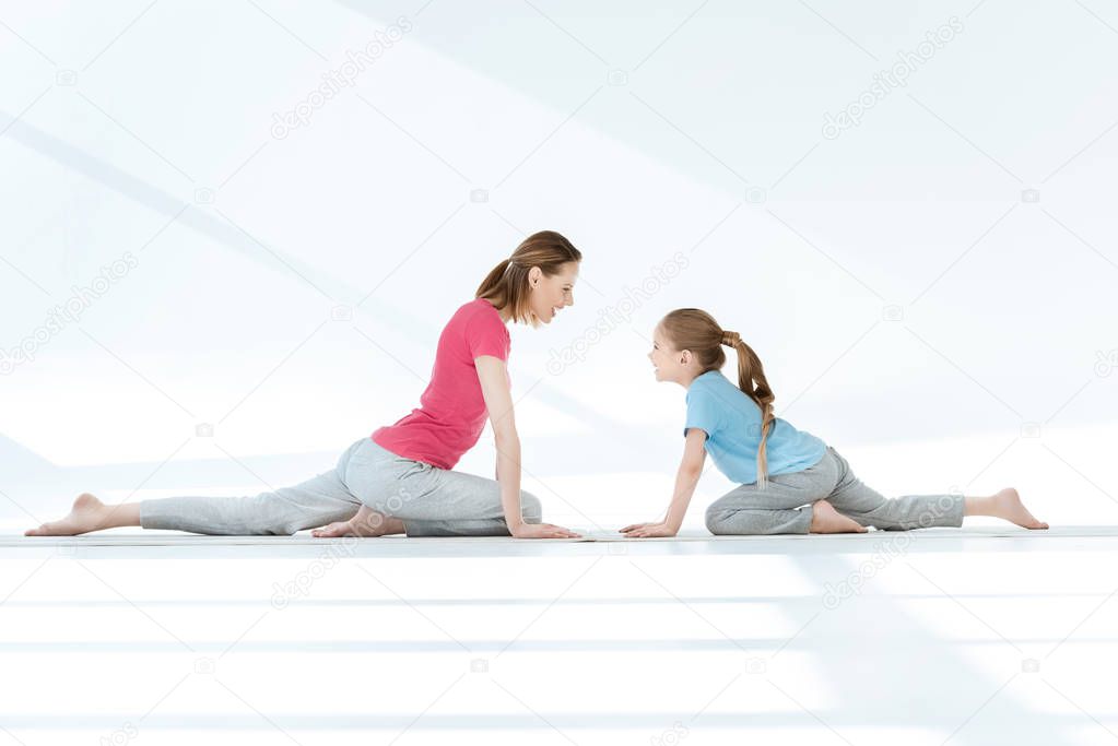 Mother and daughter exercising