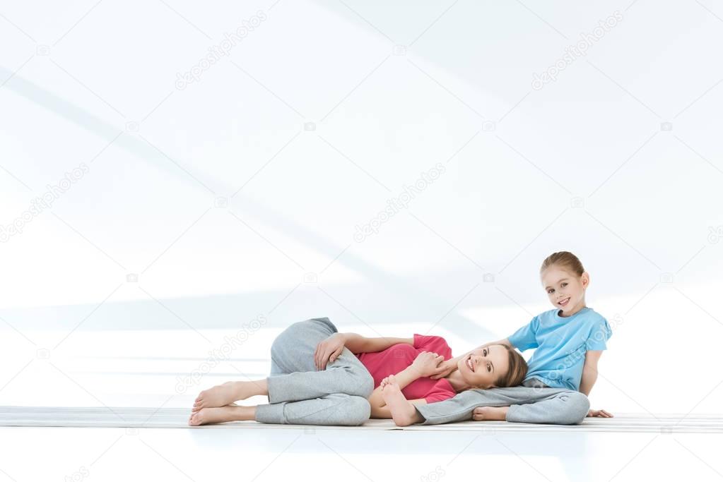 Mother and daughter exercising