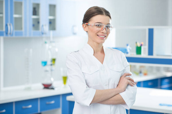 scientist in white coat and glasses