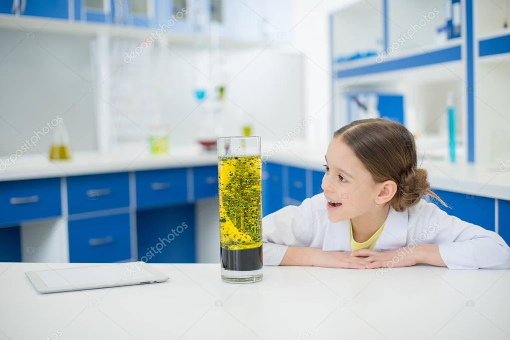 girl scientist with lab tube