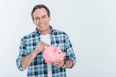 Man holding piggy bank clipart