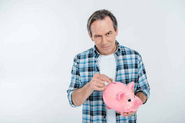 Man holding piggy bank