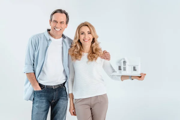 Couple with house model — Stock Photo, Image