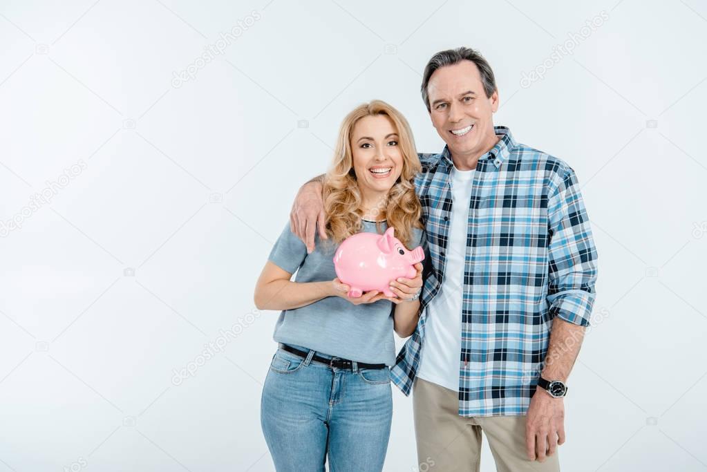 Couple holding piggy bank 