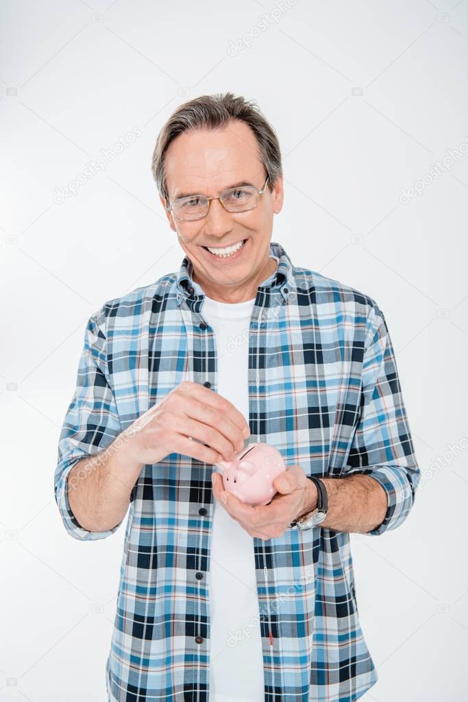 Man holding piggy bank