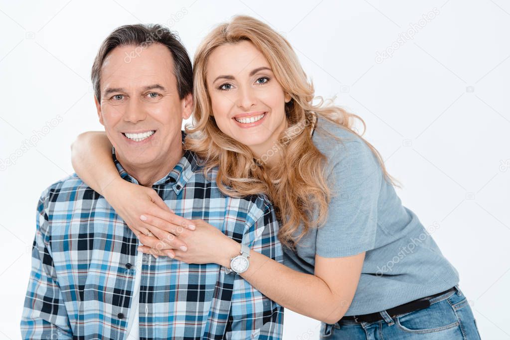 Couple embracing and smiling