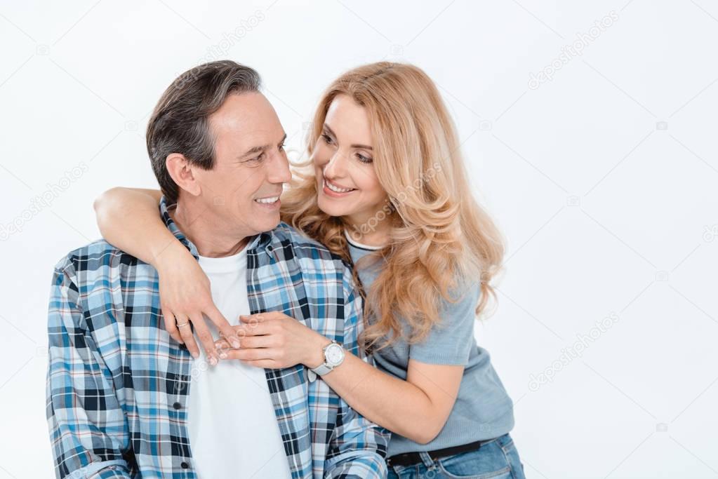 Couple embracing and smiling