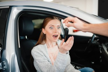 excited woman in new car clipart