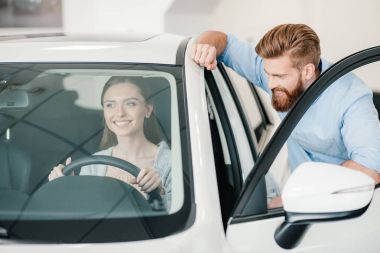 woman sitting in new car clipart