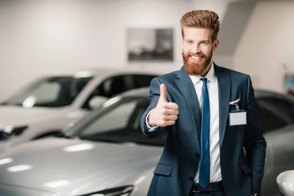 Salesman in dealership salon — Stock Photo, Image