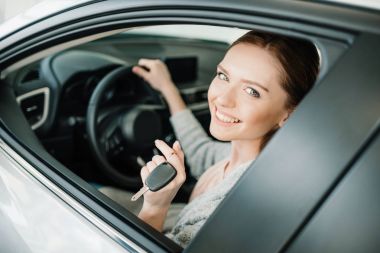 Woman sitting in new car  clipart