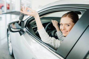 Woman sitting in new car  clipart