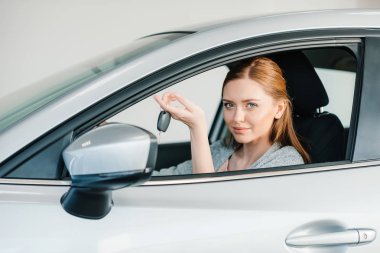 Woman sitting in new car  clipart