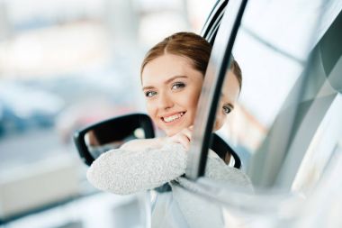 Woman sitting in new car 