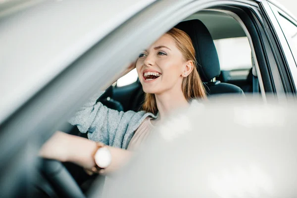 Woman sitting in new car — Stock Photo, Image