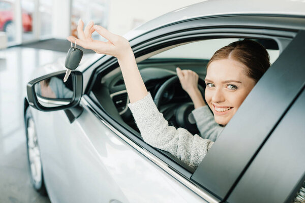Woman sitting in new car Stock Picture