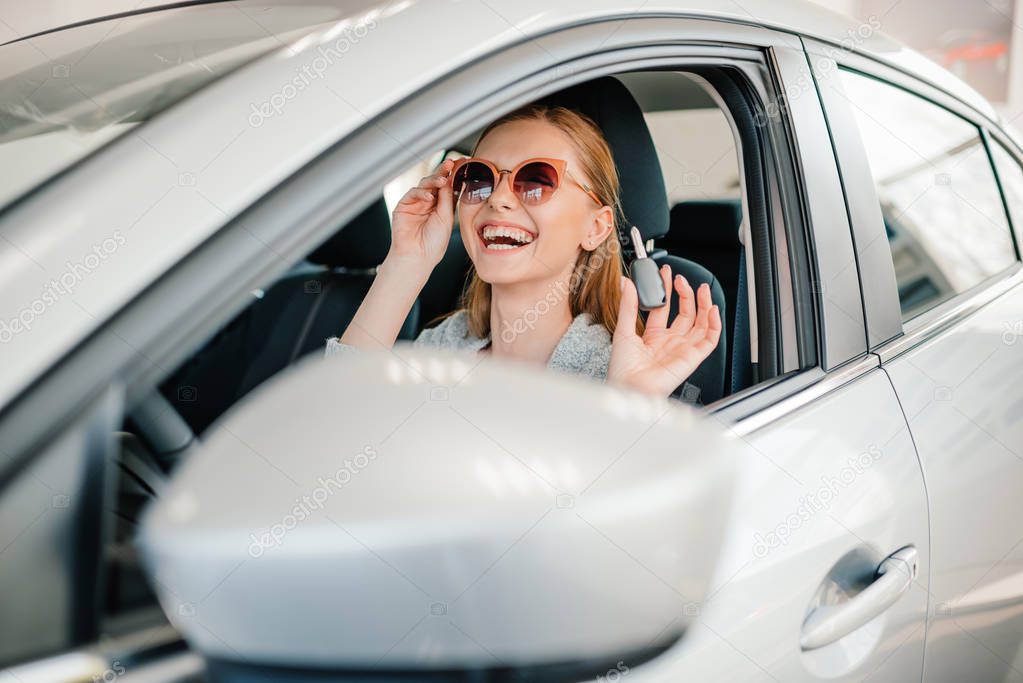 Woman sitting in new car 