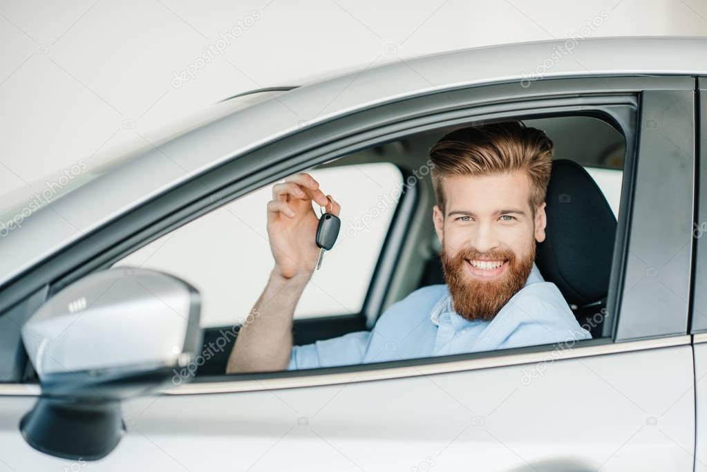 Man sitting in new car 