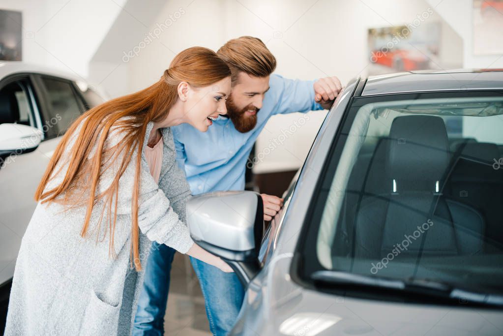 Couple choosing new car 