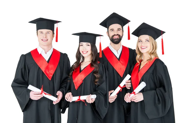 Spokojenými studenty s diplomy — Stock fotografie