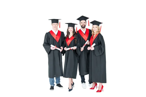Happy students with diplomas — Stock Photo, Image