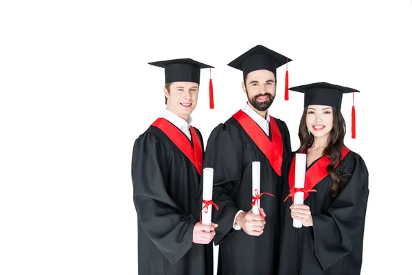 Estudantes felizes com diplomas — Fotografia de Stock