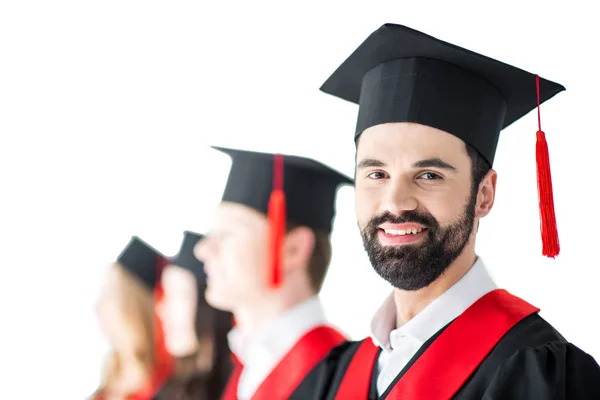 Estudante em boné de graduação com diploma — Fotografia de Stock