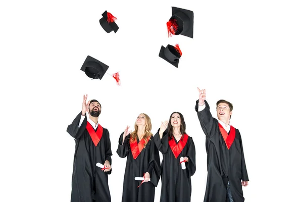 Studentów, rzucanie graduation czapki — Zdjęcie stockowe