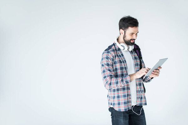 man with headphones and digital tablet