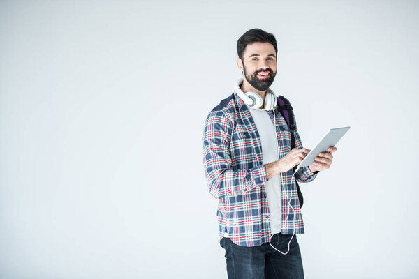 man with headphones and digital tablet