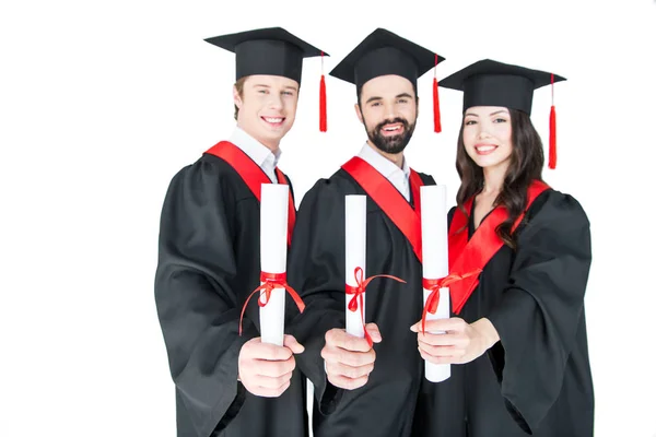 Happy students with diplomas Royalty Free Stock Photos