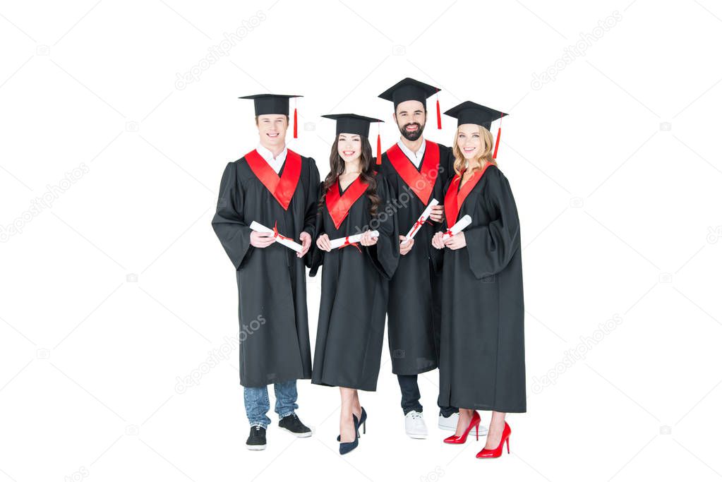 Happy students with diplomas 