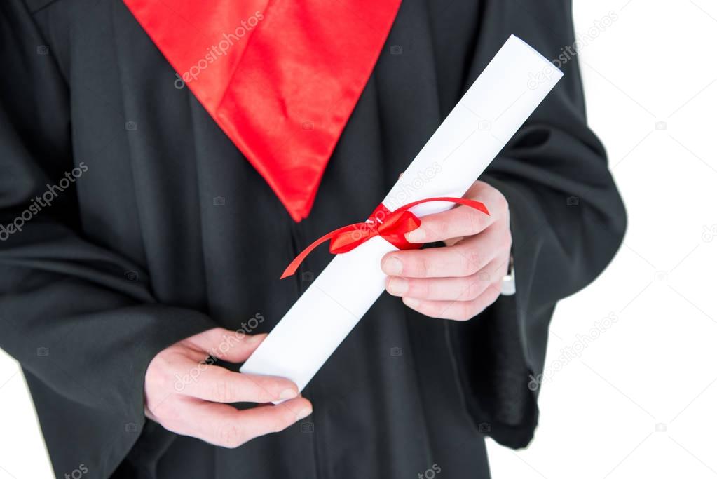 Student holding diploma 