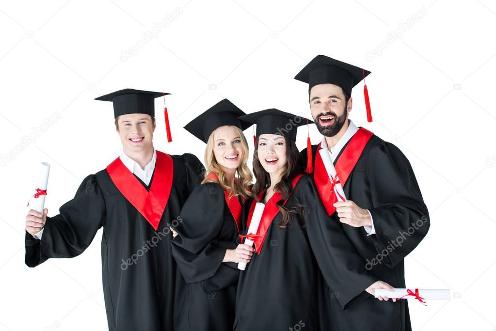 Happy students with diplomas 