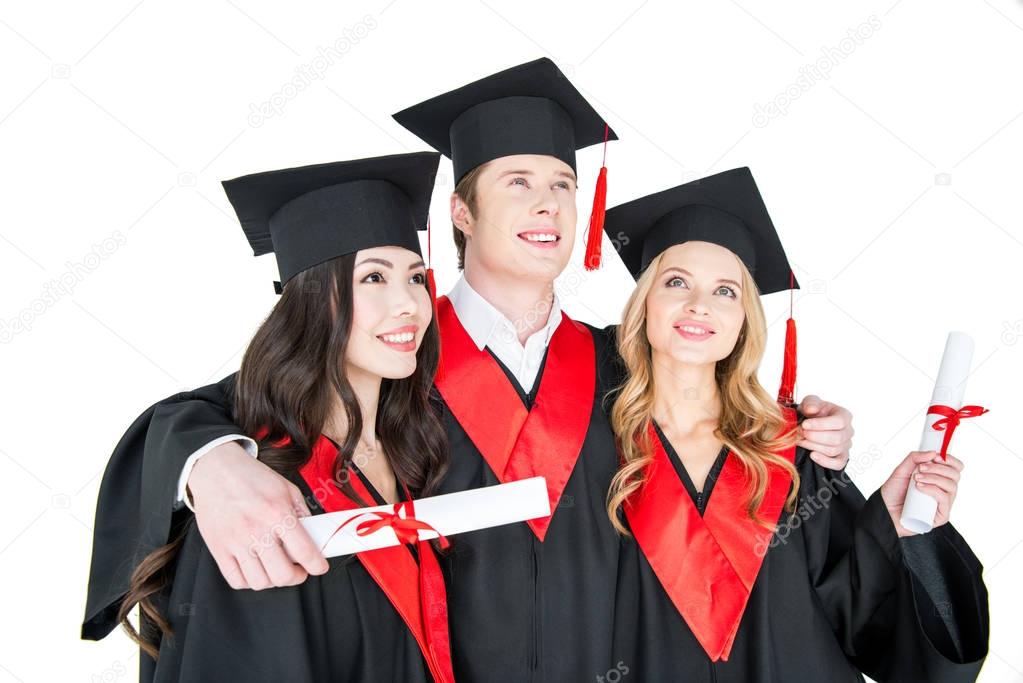Happy students with diplomas 