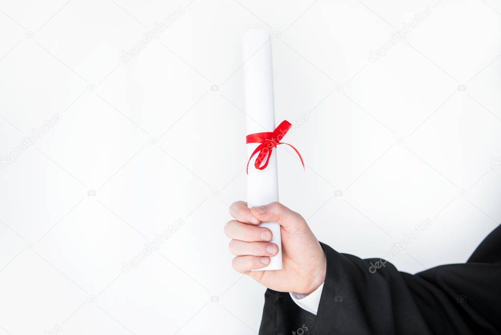 Student holding diploma 