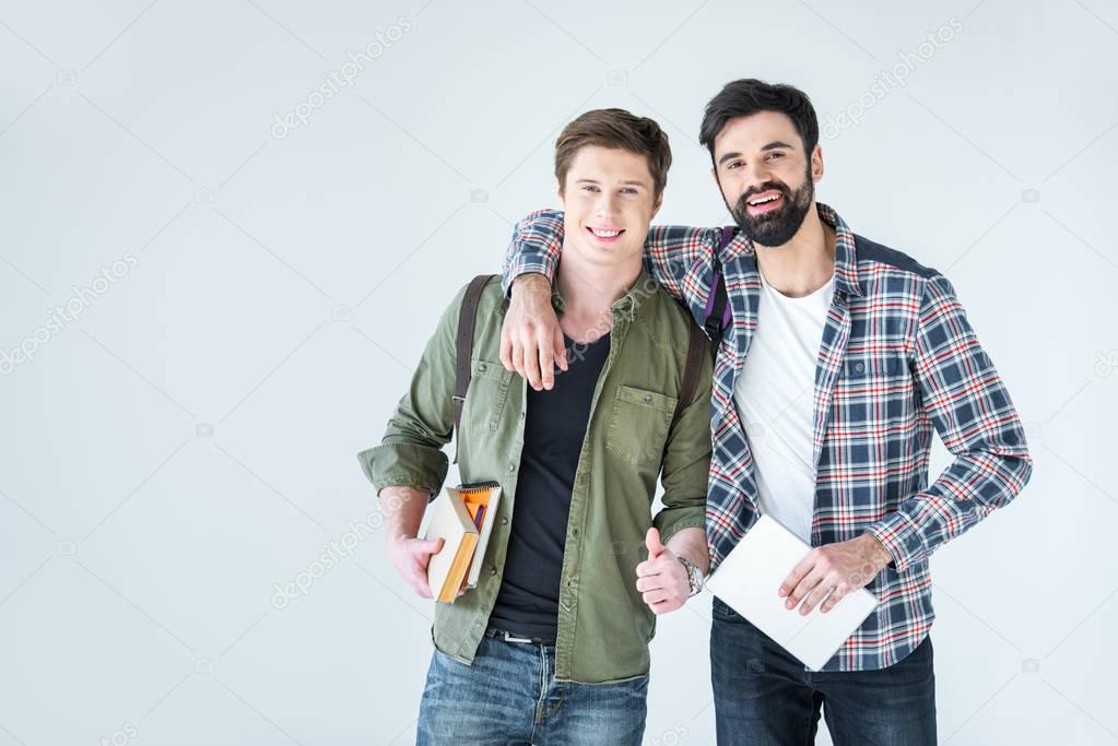 students holding books