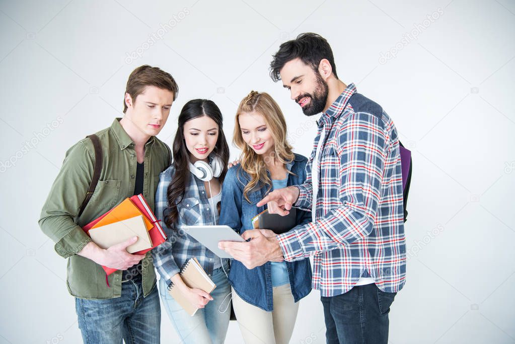 four students with books