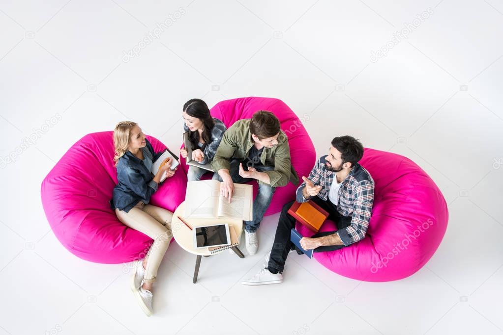 students sitting on beanbag chairs