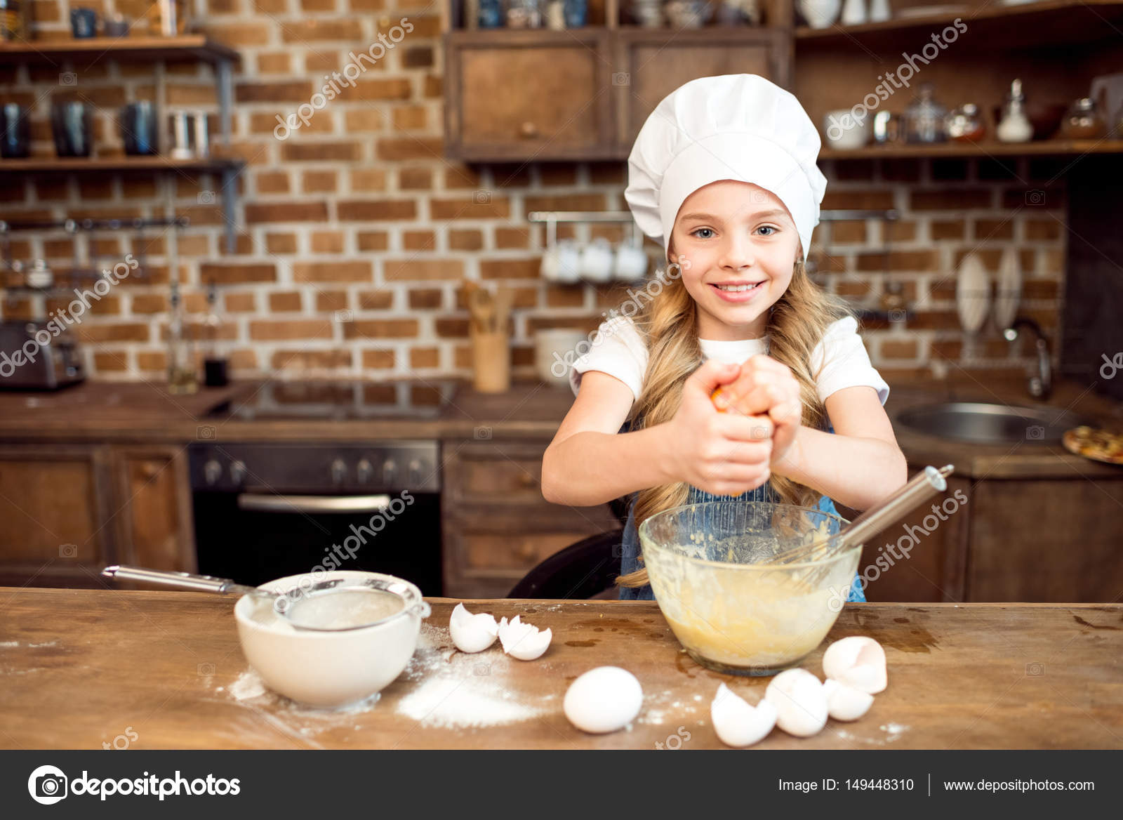 Girl making dough for cookies — Stock Photo © IgorTishenko 149448310