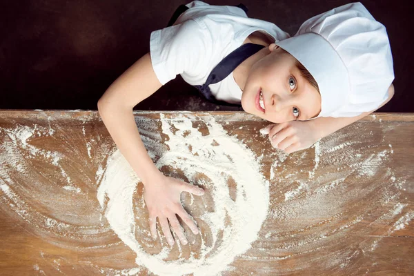 Child making pizza dough — Stock Photo, Image