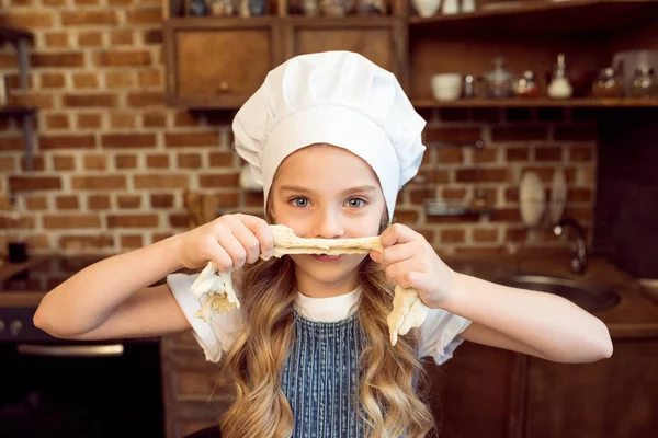 stock image girl playing with raw dough