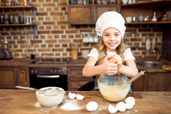 girl making dough for cookies