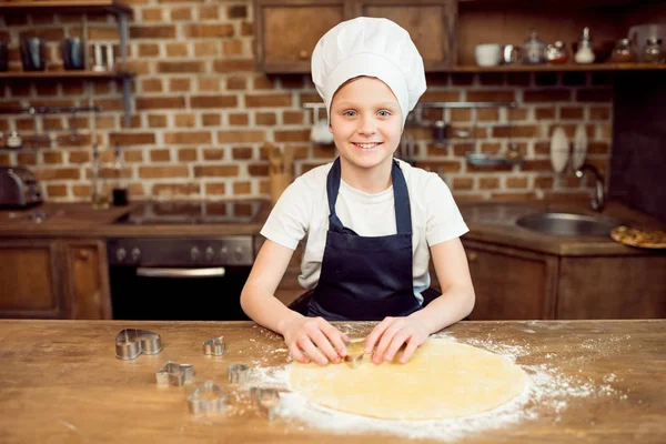 Boy making shaped cookies — Stock Photo, Image