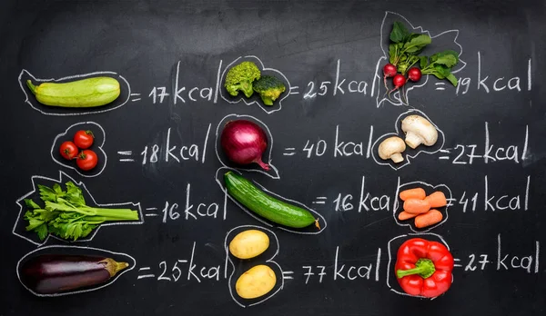 Fresh vegetables and calories table — Stock Photo, Image