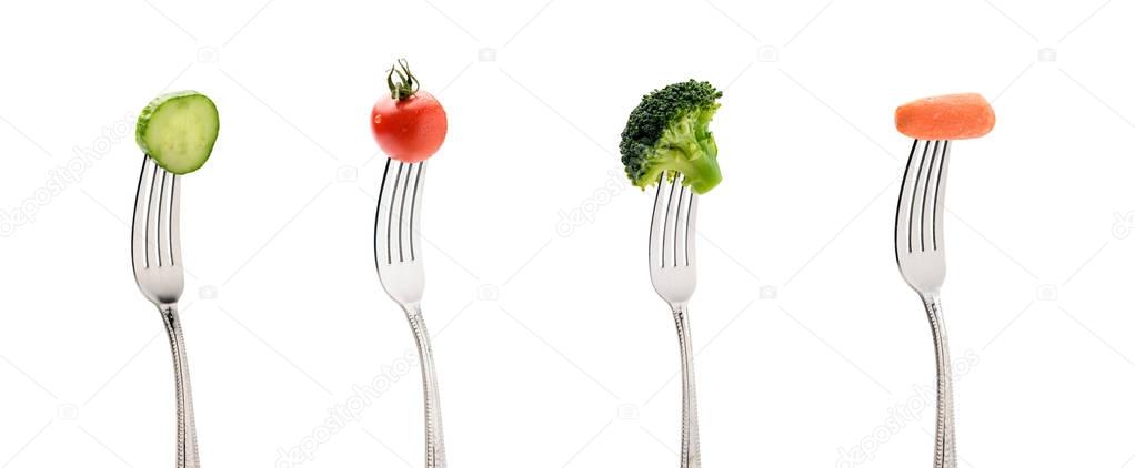 fresh vegetables on forks