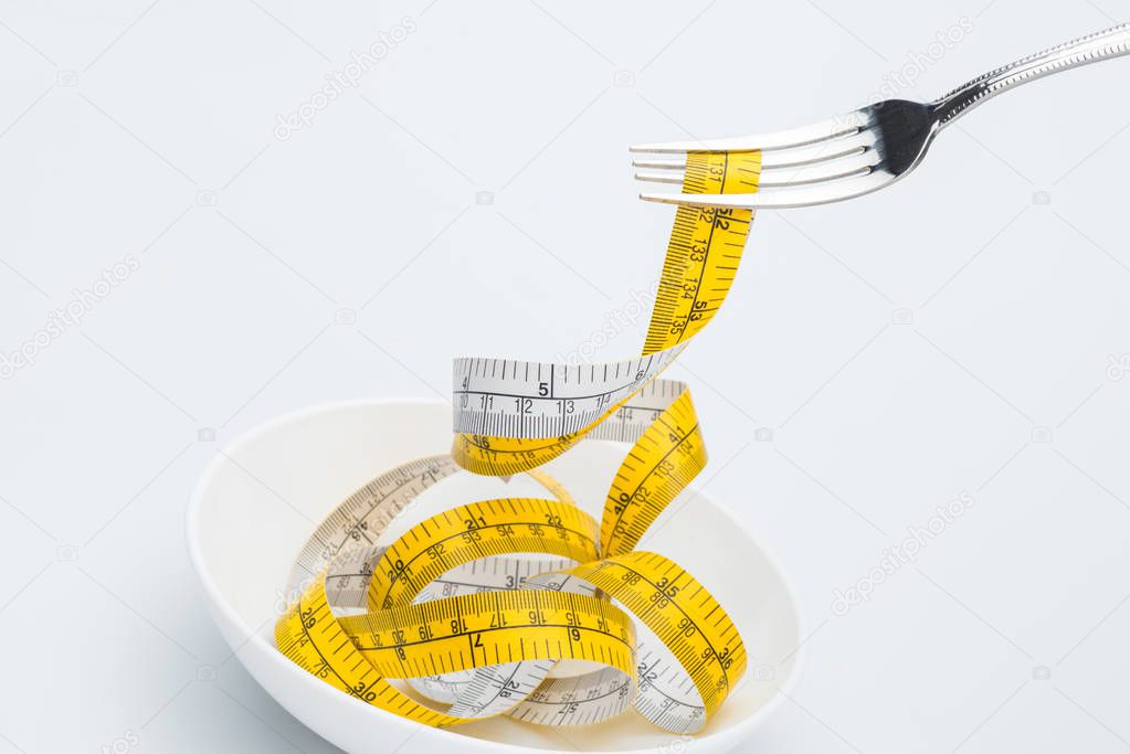 measuring tape on fork