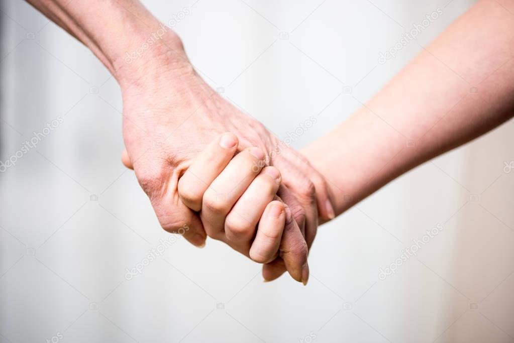 Grandmother and child holding hands